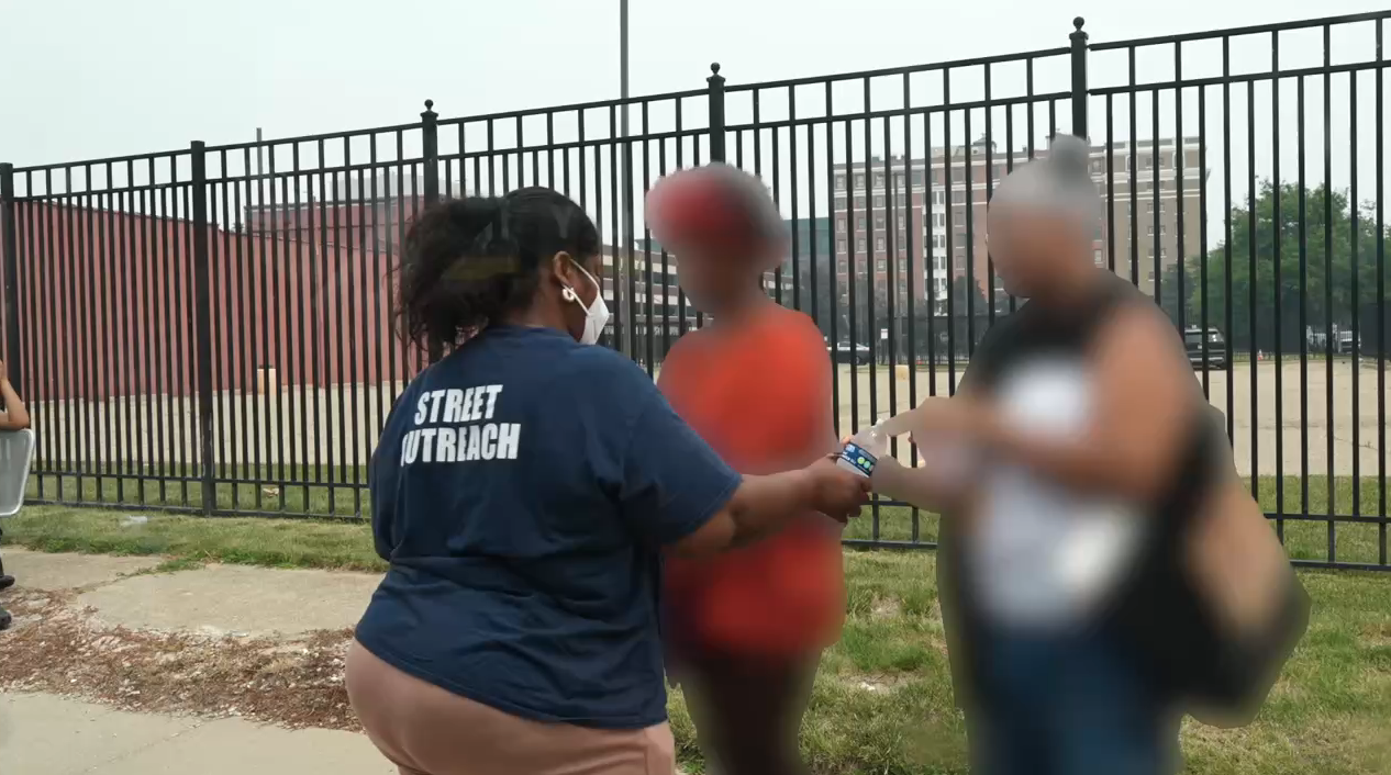'Protect yourself': Covenant House Michigan hands out masks amid toxic smoke